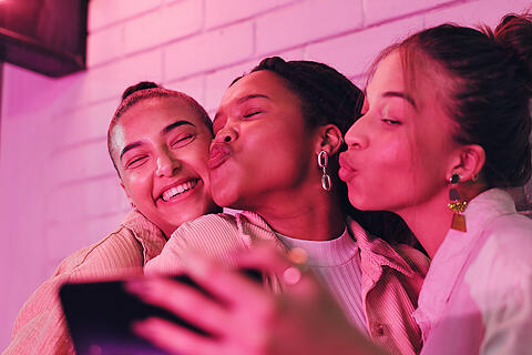 Happy woman, friends and night with selfie for photography, picture or outdoor memory on wall. Female person or young group of girls enjoying late party with smile for moment or social get together